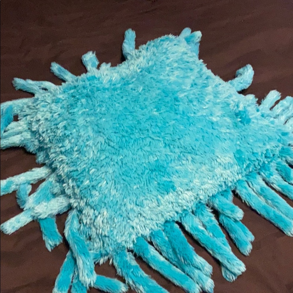 A pillow and small throw blanket set